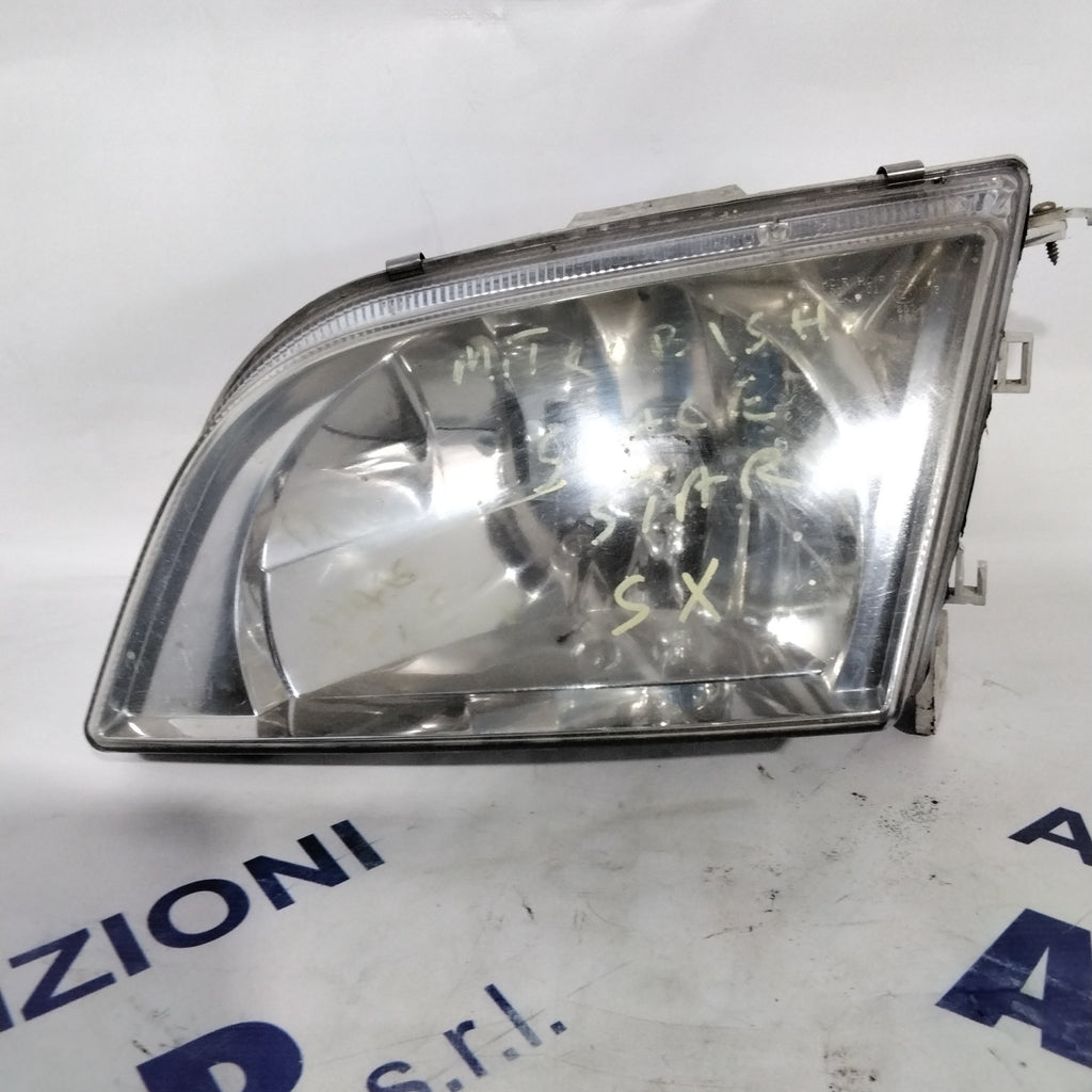 Headlight Mitsubishi Space Star left year 1999 (sf8p4)