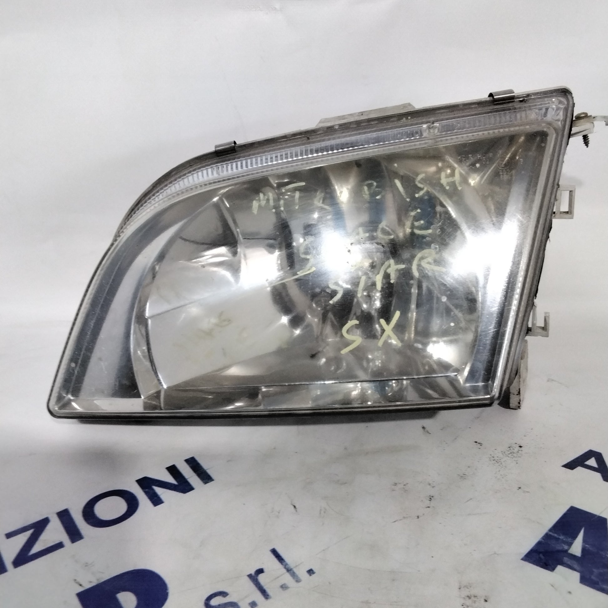 Headlight Mitsubishi Space Star left year 1999 (sf8p4)