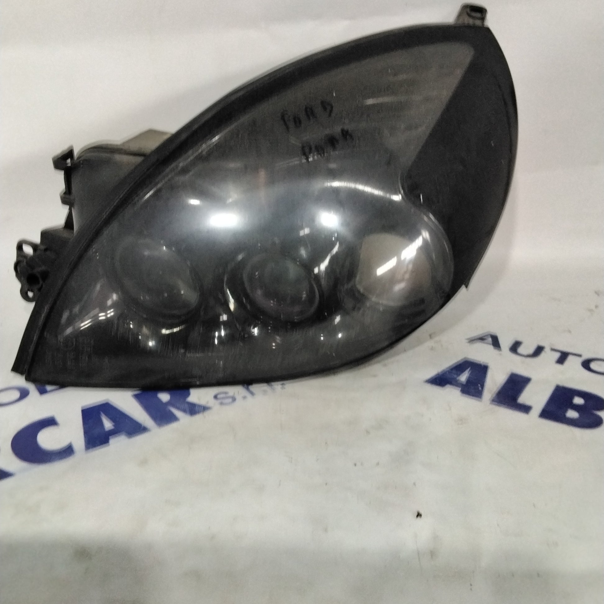 Left headlight Ford Puma year 2002 code: 0301155203 (sf8p3)