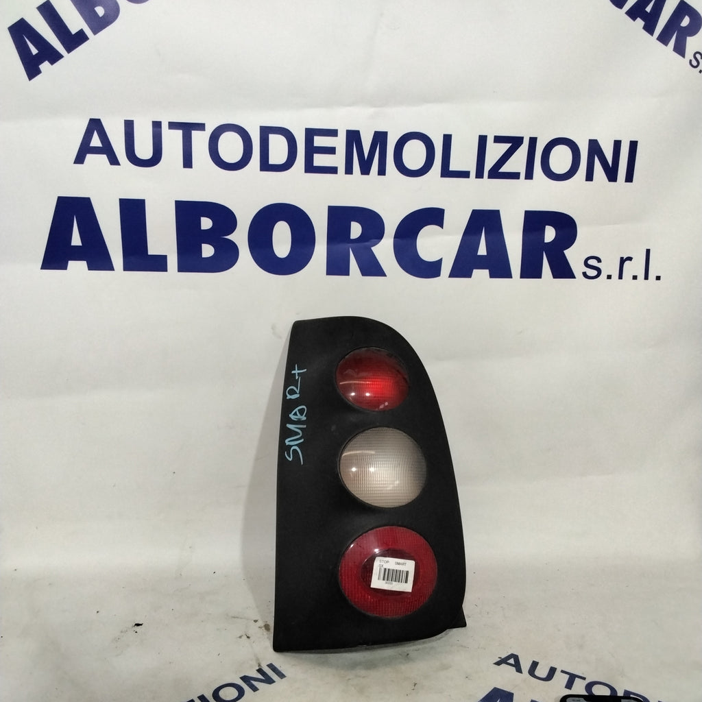 Fanale stop smart sinistro  coupe benzina cilindrata: 600 anno  2002-2004  colore nero con lampadina gialla e bianca codice: 253041L