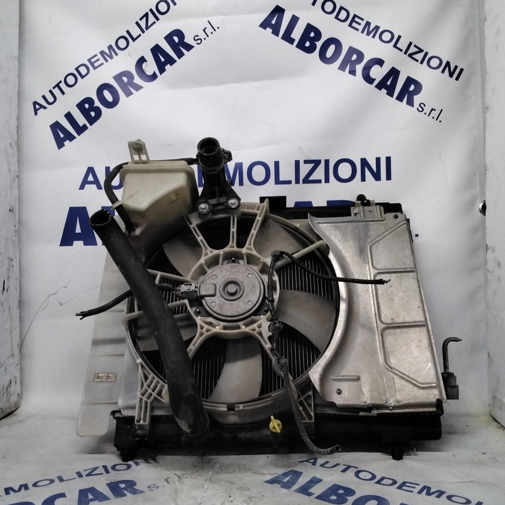 Complete radiator with fan and coolant reservoir for a 2006 Toyota Yaris petrol model.