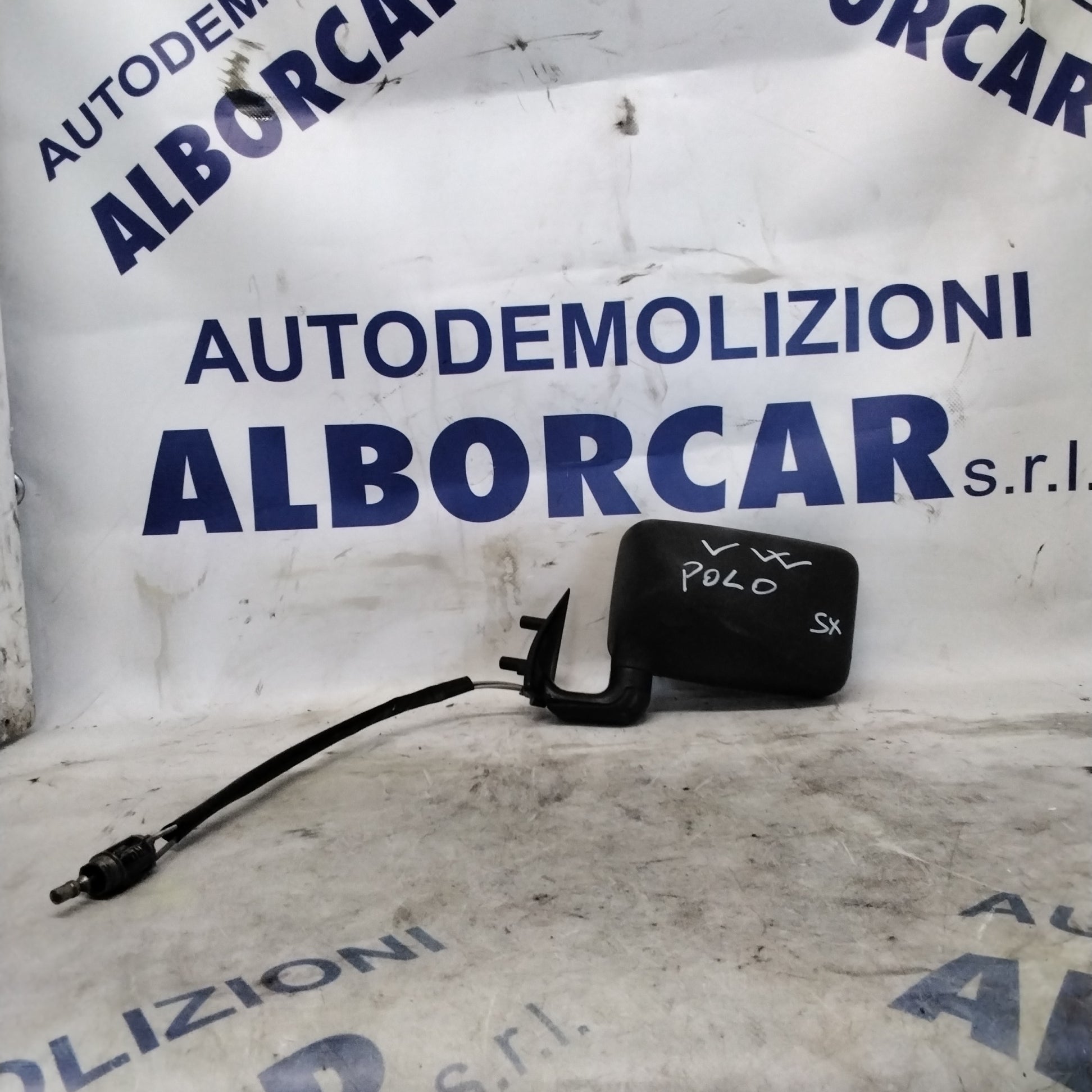 Espejo retrovisor exterior izquierdo manual Volkswagen Polo Classic año 1990 con cristal