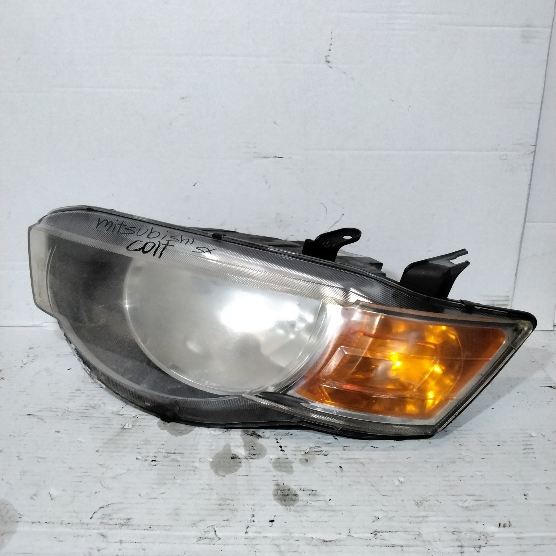 Mitsubishi Colt left headlight